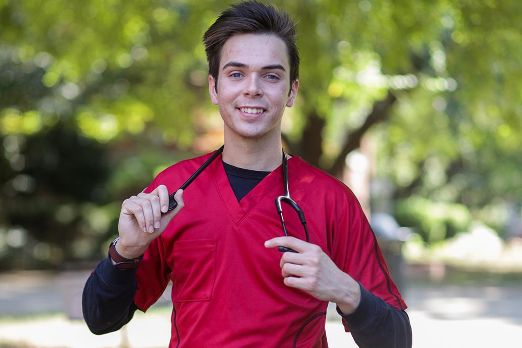 Oliver Smith poses outside of McCord building