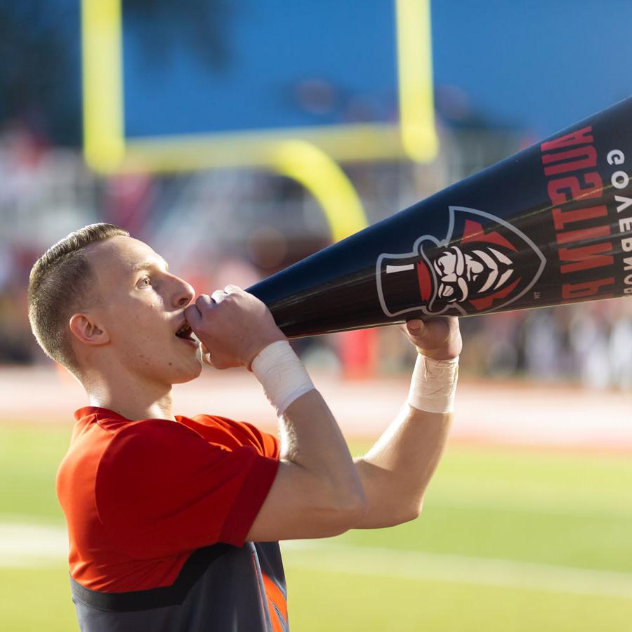 Cheerleader telling into a megaphone